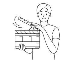 Smiling young man with movie flapper. Happy guy with film flapping showing hand gesture. Vector illustration.