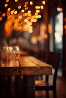 Image of wooden table in front of abstract blurred background of restaurant lights. photo