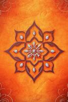 orange Pantone color background paper texture Rangoli pattern painting. photo