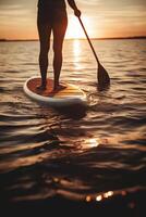 Stand up paddle boarding on quiet sea. photo