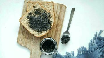 Black sesame spread on a bread video