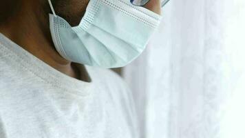 Close up of man with protective face mask taking deep breath video