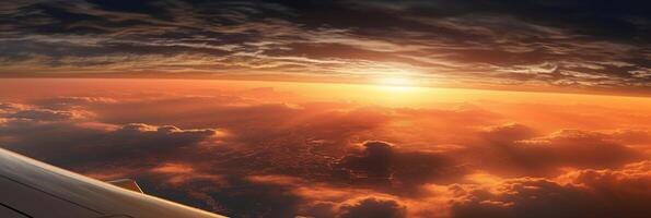The view from the plane window to the sunset. Aerial view. photo