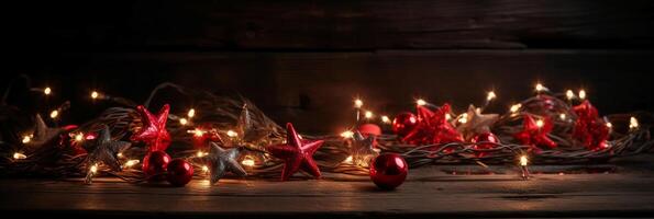 Christmas background with blue light luminous garlands and red stars on a white wooden background with copy space. photo