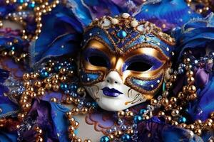 Venetian carnival mask and beads decoration. Mardi gras background. photo