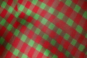 red fabric textile pattern, plaid background, linen cotton. photo