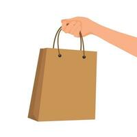 Hand holding shopping bag paper vector