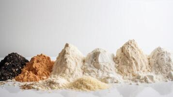 Various types of culinary flour in a row, white background. . photo