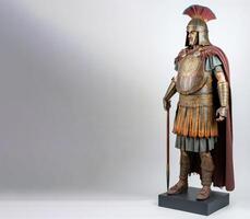 Ancient Thracian warrior in armor with weapons. White background, isolate. . photo