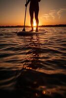 Stand up paddle boarding on quiet sea. photo