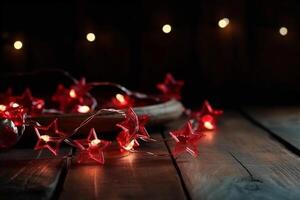 Christmas background with blue light luminous garlands and red stars on a white wooden background with copy space. photo