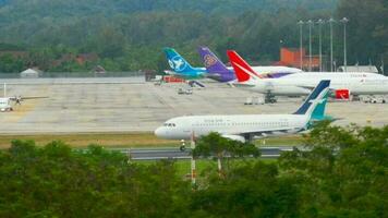 PHUKET, THAILAND DECEMBER 2, 2016 - SilkAir Airbus A319 9V SBH runway turn before departure from Phuket airport. Rainy weather video