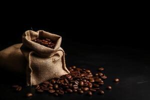 Top view of coffee beans in a sack on dark background. photo