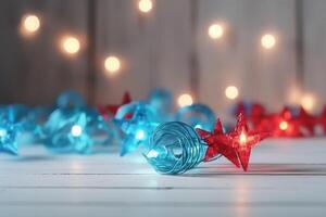 Christmas background with blue light luminous garlands and red stars on a white wooden background with copy space. photo
