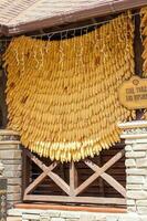 2021-05-07. Russia. Kamensk-Shakhtinsky, Rostov region. Beautiful decor elements in the park for tourists. A canopy on a building made of corn cobs. photo