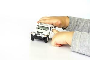 A child plays with a typewriter. Close-up of a child's hand. photo