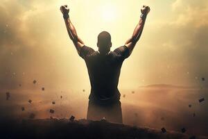 Successful happy accomplished athletic man stands with raised arms facing the sun. photo