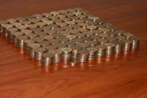 Moscow, 2012-10-15, Five-ruble coins are lying on the table in neat piles. photo