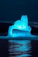 photo of luminescent iceberg, amazing nature.