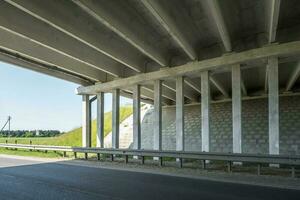 concrete columns like pillars of an automobile bridge photo