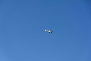 Moscow, Russia, 2018-08-25, exhibition of military equipment, display of military vehicles in action. Reconstruction of life and combat operations. A plane in a clear sky. photo