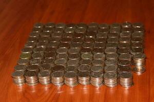 Moscow, 2012-10-15, Five-ruble coins are lying on the table in neat piles. photo