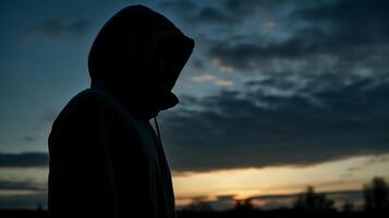 Side view, Silhouette of the face, a person, low angle, blurred fresh dawn sky. photo