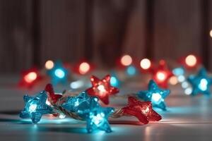 Christmas background with blue light luminous garlands and red stars on a white wooden background with copy space. photo