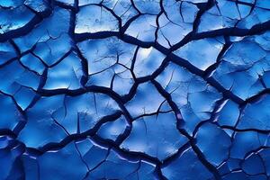 Ice winter floor cracks blue background. photo