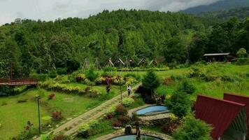 Bandung June 12 2022. Aerial view of public park and traditional hotel in hills, in Bandung City, West Java - Indonesia. video