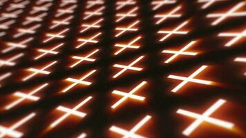 Abstract orange pattern of glowing geometric crosses pluses loop futuristic hi-tech black background video