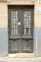 Old ancient wooden door texture in european medieval style photo