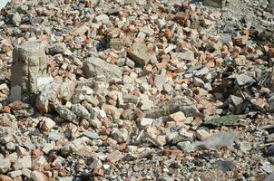 Pile of bricks and fragments of concrete from destroyed building photo