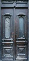 Old ancient wooden door texture in european medieval style photo