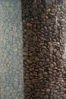 fresh coffee beans in a glass jar photo