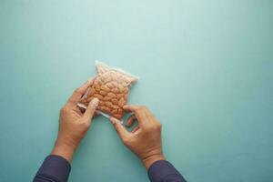 men holding a almond nut packet photo