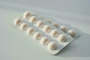 Close up of pills of blister pack on table photo