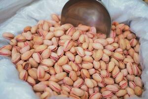 detail shot of pistachios nut on in bowl photo