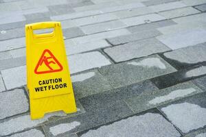 Sign showing warning of caution wet floor photo