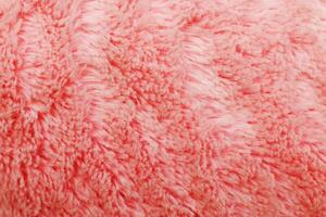 pink fluffy textile texture. Nappy hairy background closeup. photo