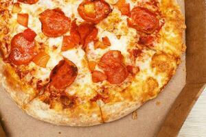 pizza in cardboard box. fast food delivery concept photo