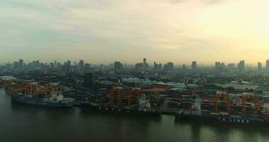 Aerial view 4k drone of container ships and lifting cranes in the Port of Bangkok on sunrise. 2018-07-24 Thailand. video