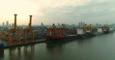 Aerial view 4k drone of container ships and lifting cranes in the Port of Bangkok on sunrise. 2018-07-24 Thailand. video