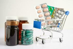 Drug capsule pill from drug prescription in in shop trolley at drugstore, pharmacy for treatment health medicine. photo