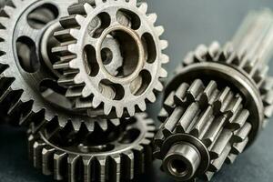 Gear and cogs wheels, clock mechanism, brass metal engine industrial. photo