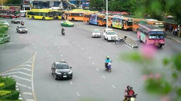 Slow motion Heavy Traffic in the Center of Bangkok around Victory Monument in Bangkok, Thailand video