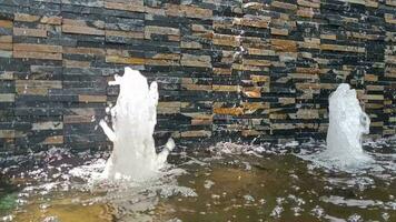 Slow motion video clip of garden fountains