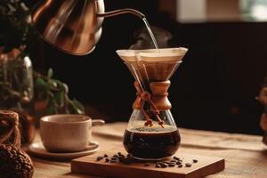 Alternative coffee brewing method,pure over,glass teapot on wooden tray with brewed coffee on dark background. photo