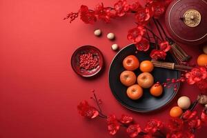 Chinese New Year festival decorations, mandarins, flowers, envelopes . Flat lay, top view. photo