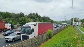 Beautiful Footage of British Motorways and Highways with Fast Moving Traffic During Busy and Rush Hours. The Footage Was Captured from Services of M1 Junction 12 Toddington England UK on 25-May-2023 video